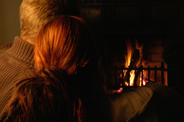 Couple in front of Fireplace