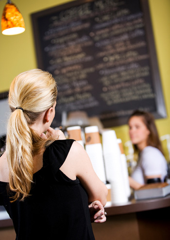 Woman in Line at Coffee Shop
