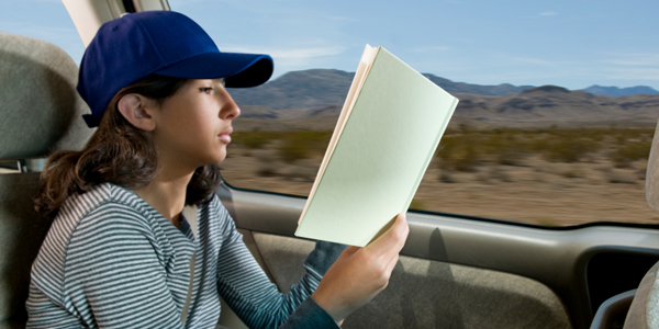 Girl Reading in Car