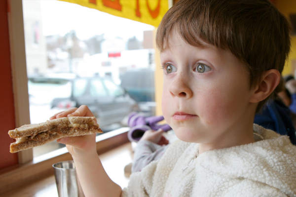 Boy eating whole grain bread