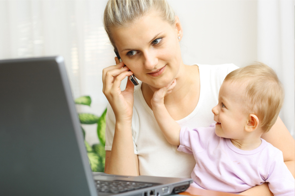 Mother at Computer with Infant