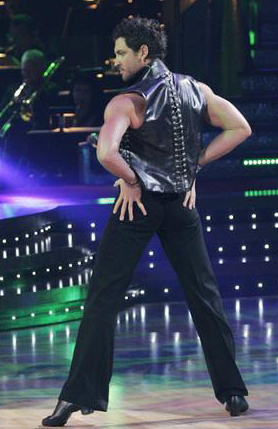 Maksim strikes a Dancing with the Stars pose