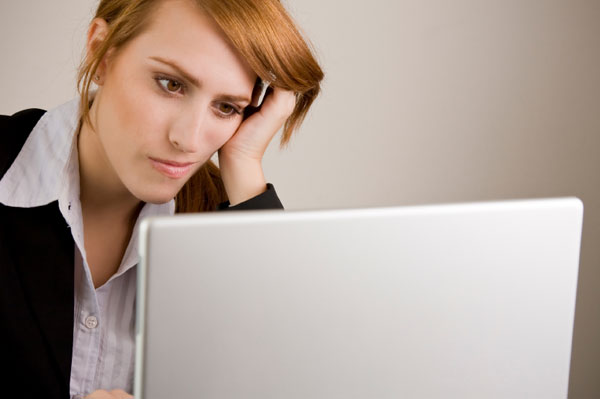 Frustrated Woman at Computer