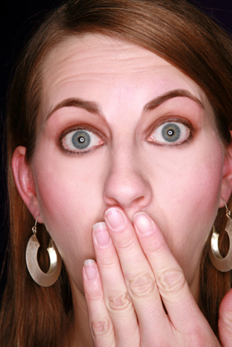 Woman covering mouth