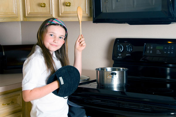 Girl with Oven Mitt Cooking
