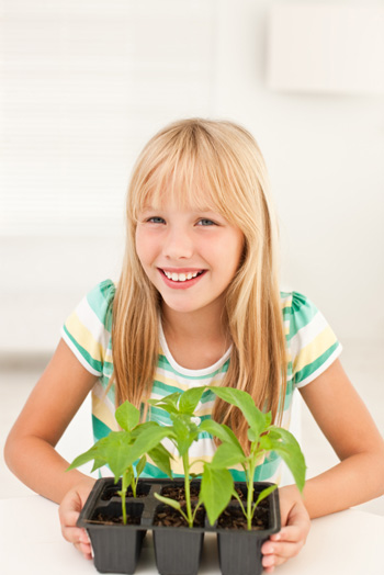 Girl with plants indoors