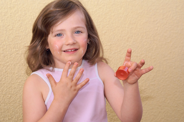 Girl Applying Face Cream