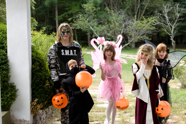 Group of tweens trick or treating