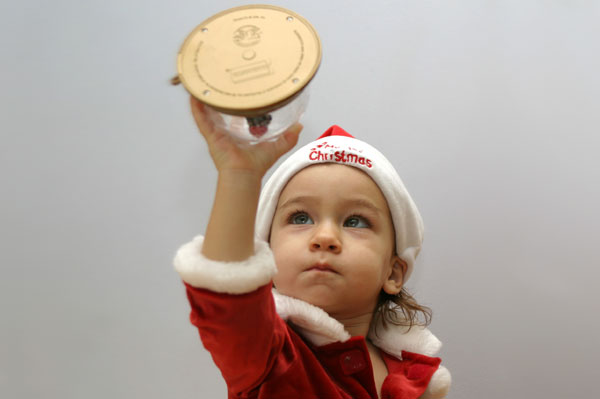 Child and Snow Globe