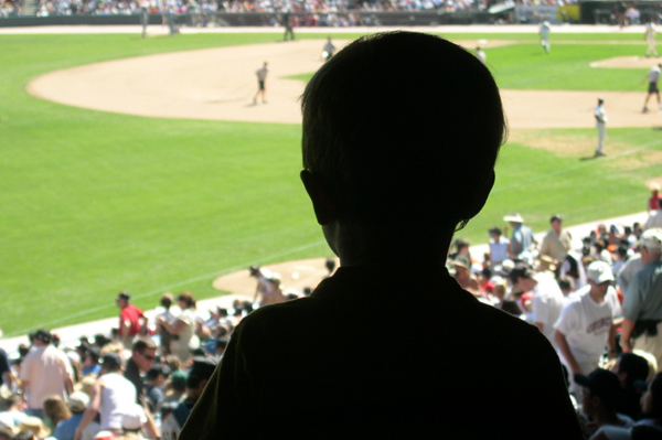 Little boy at baseball game