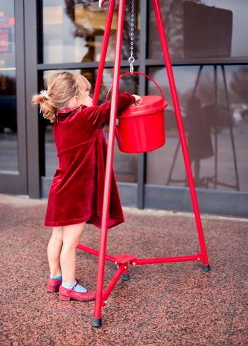 Little girl making donations