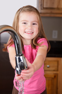 Little girl washing hands