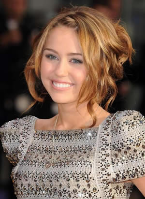 messy updo hairstyles. Miley Cyrus#39; messy updo