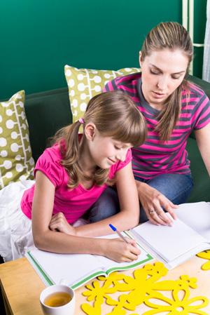 Mom homeschooling daughter