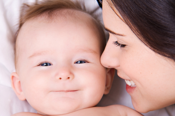 images of babies smiling. Mother Smiling with Newborn