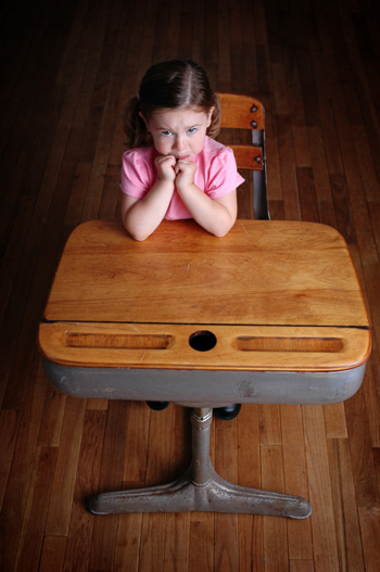 Nervous Girl at School Desk