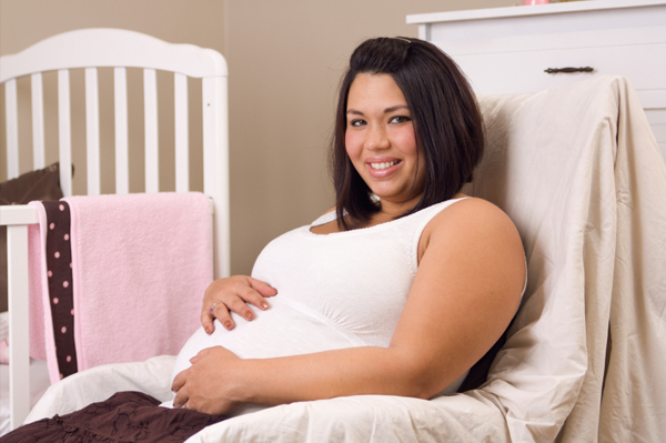 Pregnant woman in nursery