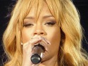 Rihanna whacks grabby fan with microphone during concert