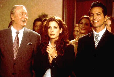 Michael Caine, Sandra Bullock and Benjamin Bratt share a laugh