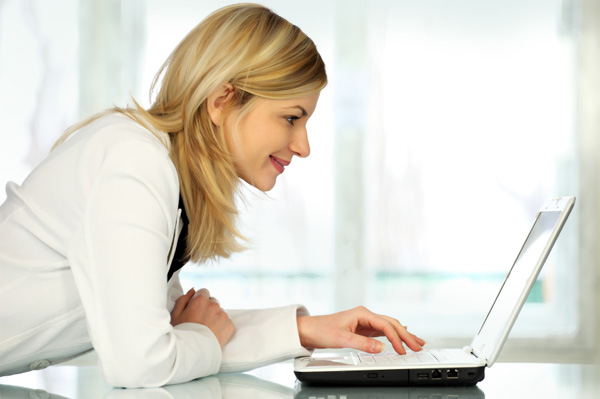 Smiling woman at computer