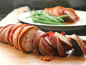 Spice-rubbed pork tenderloin wrapped in bacon