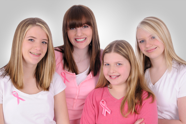 Teen Girls wearing breast cancer ribbons