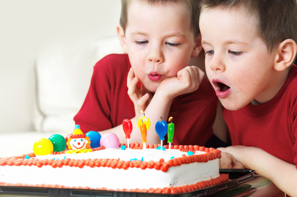 [Image: twins-blowing-out-birthday-candles.jpg]