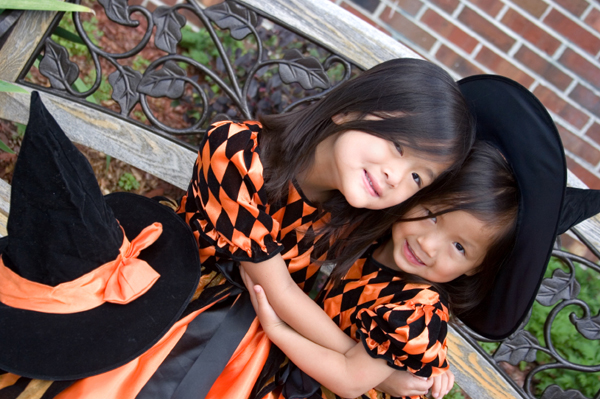 Two girls dressed up like witches