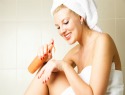 Woman Applying Lotion