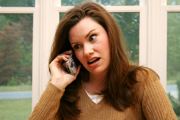 Woman being criticized on the phone