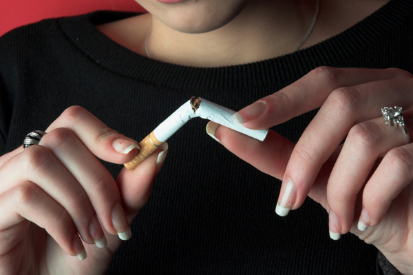 Woman Breaking Ciggarette