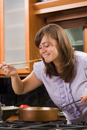 Woman Cooking in Kitchen