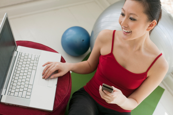 Woman downloading exercise video