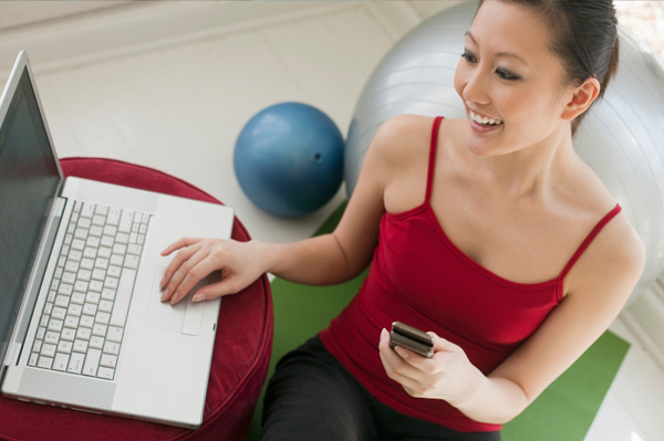 Woman Exercising Near Computer