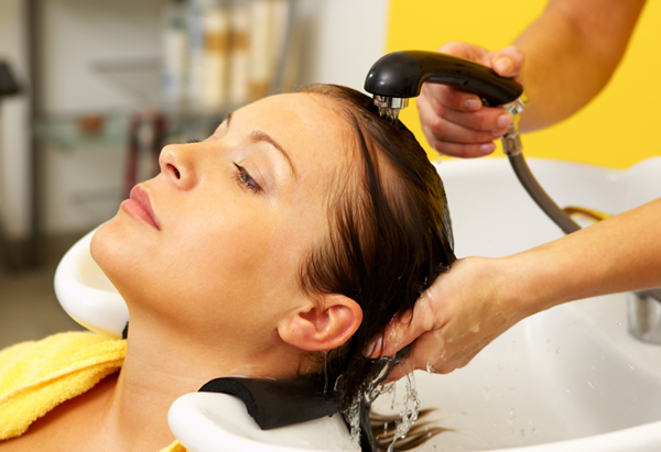 How much should I tip my hair stylist? - woman-hair-salon-rinse