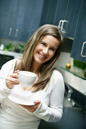 Woman in Kitchen with Coffee