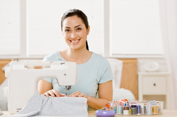 Woman sewing at home