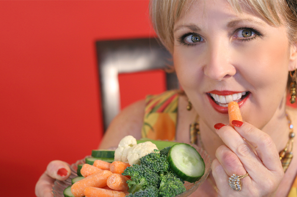 Woman snacking on vegetable platter