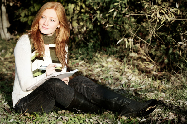Woman Writing Outdoors