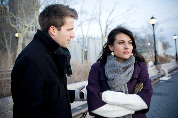 Young couple fighting in public