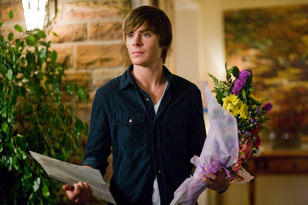 Who could resist Zac Efron with flowers?