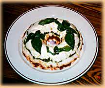 Cheese spread with pesto, tapenade and sun dried tomatoes