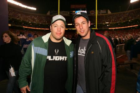 Adam Sandler and Kevin James pose at a football game