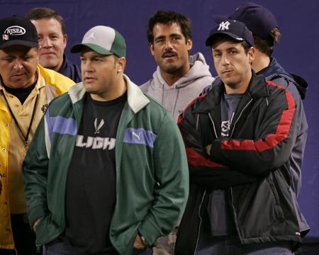 Adam Sandler and Kevin James stand on the sidelines