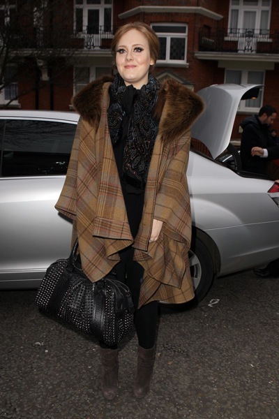 Adele with chocolate colored wardrobe