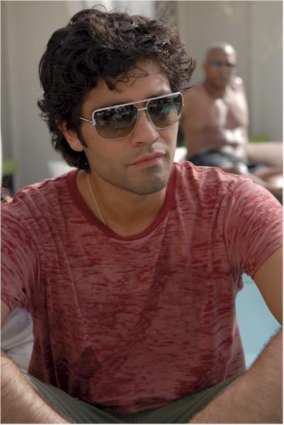 Adrian Grenier looks very relaxed in this poolside shot