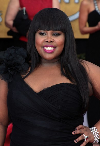 Amber Riley's sleek hairstyle with blunt bangs