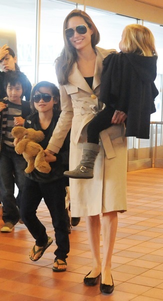 Angelina Jolie in a trench coat