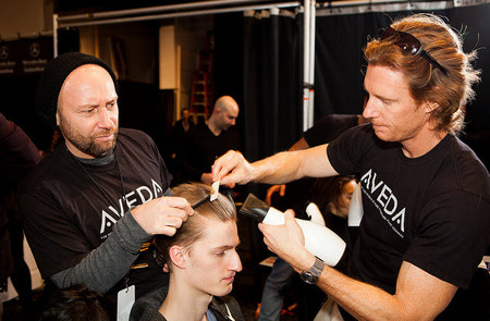 Male model gets his hair styled