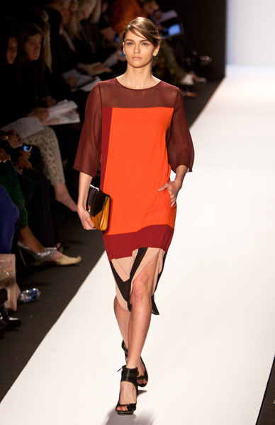 Sheer-shouldered orange and maroon dress
